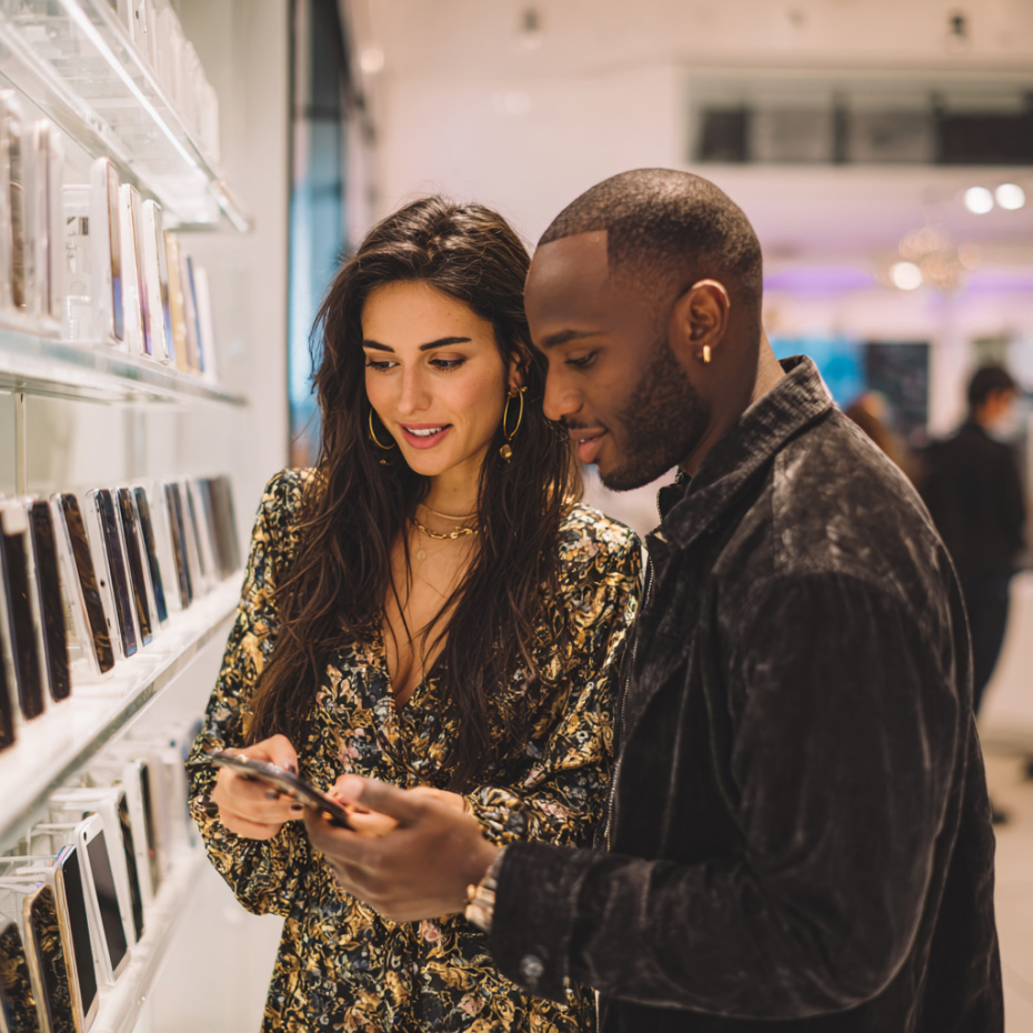 A man and woman looking to sell an iPhone 17 pro for cash